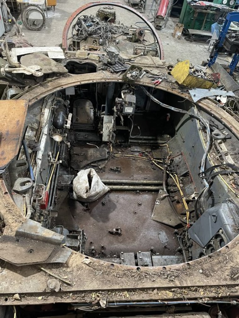 Civilian mechanics at this site near the frontlines of the war have also retrofitted some equipment for other purposes, such as this old T-72 tank that they are turning into a mobile repair vehicle for soldiers to use.