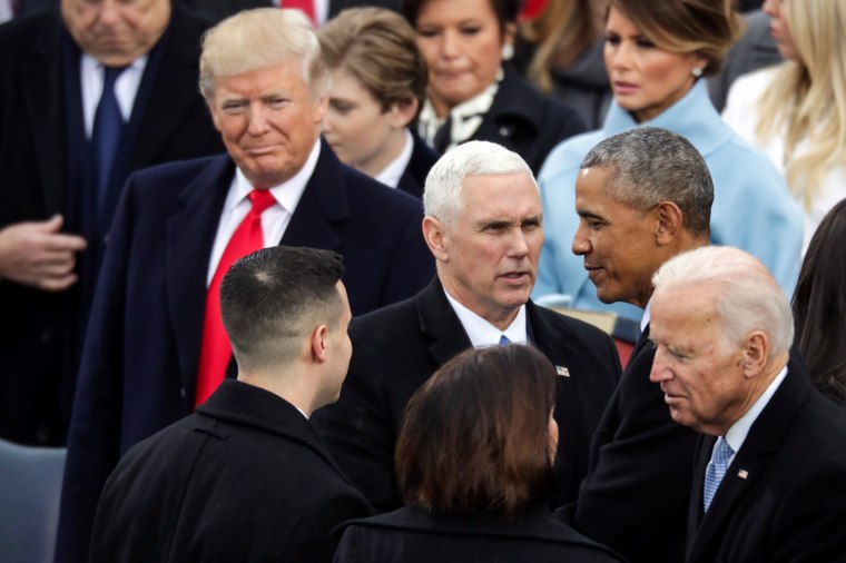 President-elect Donald Trump looks on as President Barack Obama and former Vice President Joe Biden congratulate Vice President Mike Pence after he took the oath of office on Jan. 20, 2017.