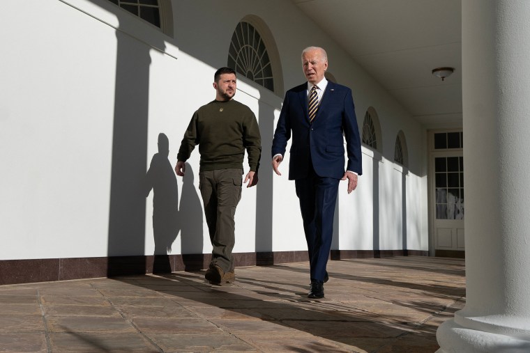 President Joe Biden walks with Ukrainian President Volodymyr Zelenskyy 