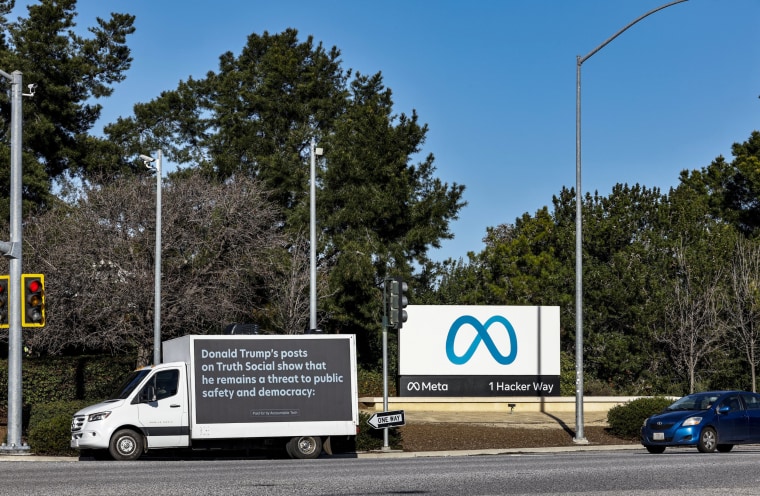 A mobile billboard, deployed by Accountable Tech, is seen outside the Meta headquarters in Menlo Park, Calif.