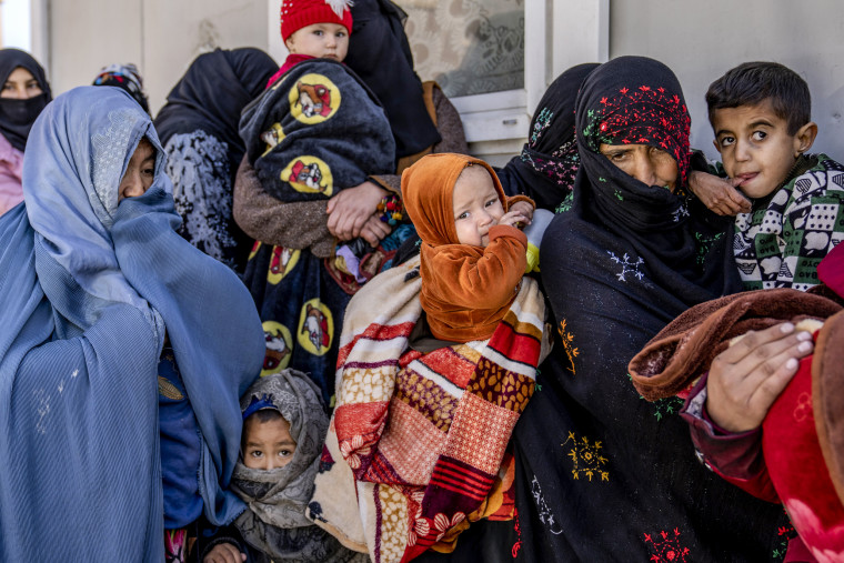 Mothers along with babies who suffer from malnutrition wait to receive help at a clinic that run by the World Food Program in Kabul, Afghanistan, on Jan. 26, 2023.