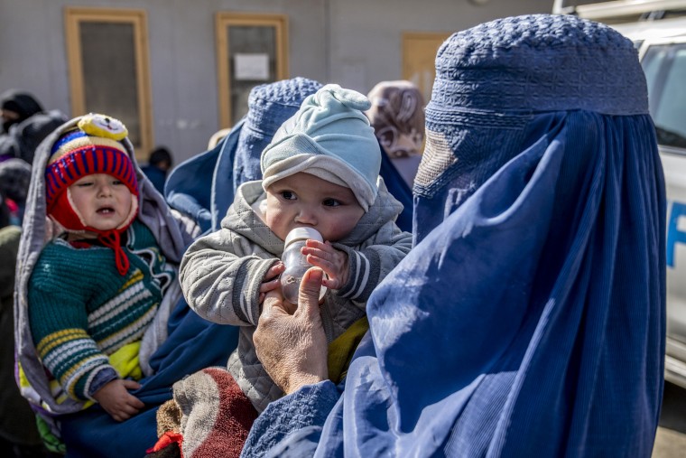 Mothers along with babies who suffer from malnutrition wait to receive help at a clinic that run by the World Food Program in Kabul, Afghanistan, on Jan. 26, 2023.
