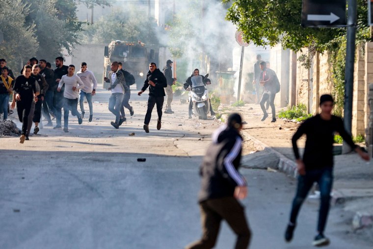 An Israeli raid on the West Bank's Jenin refugee camp today killed four Palestinians including an elderly woman, Palestinian officials said, also accusing the army of using tear gas inside a hospital.