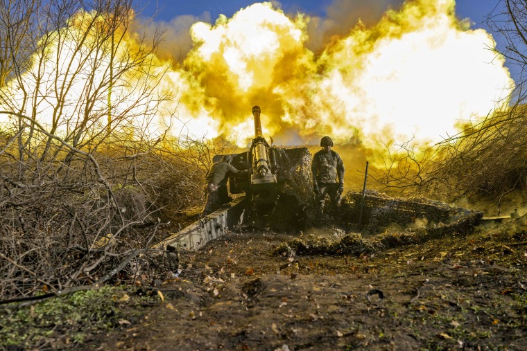 A Ukrainian soldier of an artillery unit fires towards Russian positions outside Bakhmut on Nov. 8, 2022. 