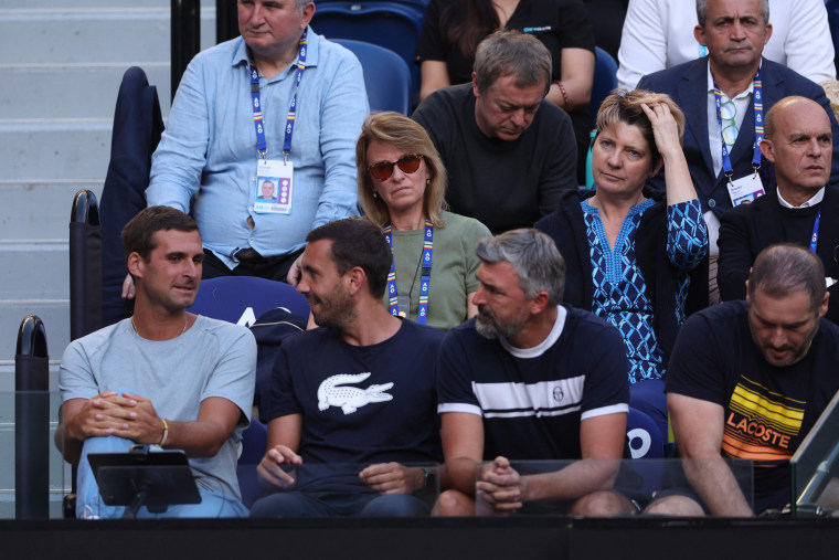 Novak Djokovic's father Srdjan said he will not attend his son's Australian Open semi-final to avoid further "disruption" after he was pictured with fans holding Russian flags.