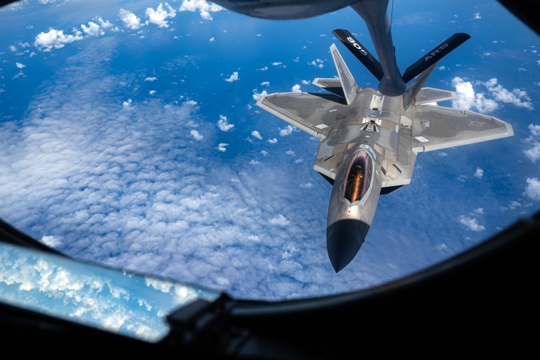 A 199th Fighter Squadron F-22A Raptor approaches a 909th Air Refueling Squadron KC-135 Stratotanker over the East China Sea June 8, 2022. The 199th FS conducted agile combat employment operation in the Pacific to strengthen the readiness and interoperability needed to defend Japan and ensure a free and open Indo-Pacific. (U.S. Air Force photo by Senior Airman Stephen Pulter)