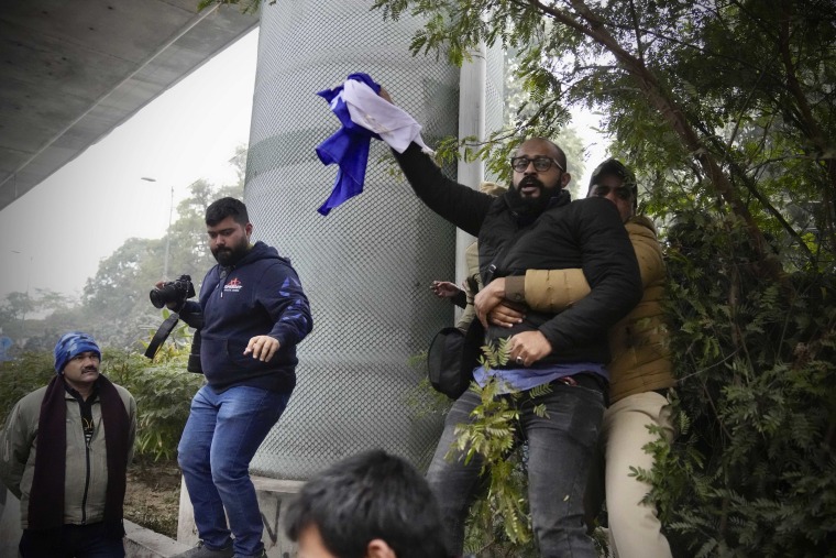 Tensions escalated in the university after a student group said it planned to screen a banned documentary that examines Indian Prime Minister Narendra Modi's role during 2002 anti-Muslim riots, prompting dozens of police equipped with tear gas and riot gear to gather outside campus gates.