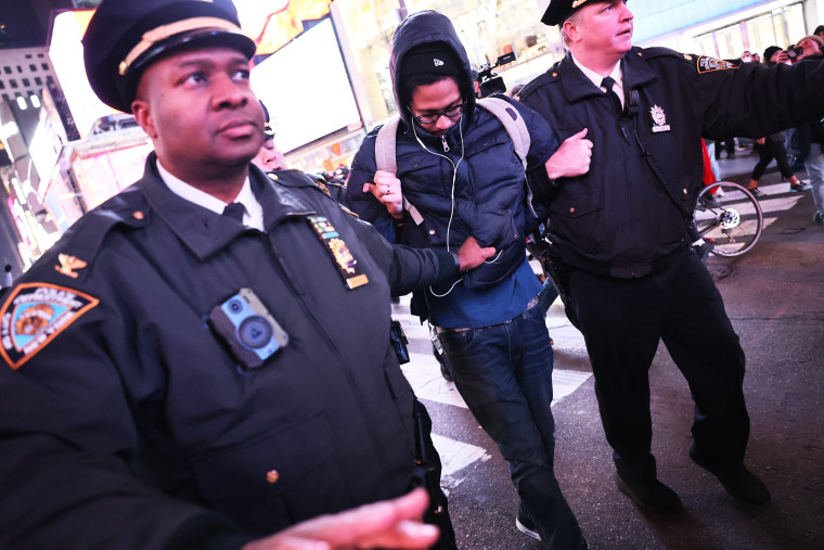 NEW YORK, NEW YORK - JANUARY 27: NYPD officers arrest a demonstrator as people protest the death of Tyre Nichols on January 27, 2023 in New York City. The release of a video depicting the fatal beating of Nichols, a 29-year-old Black man, sparked protests in NYC and other cities throughout the country. Nichols was violently beaten for three minutes and killed by Memphis police officers earlier this month after a traffic stop. Five Black Memphis Police officers have been fired after an internal investigation found them to be â€œdirectly responsibleâ€ for the beating and have been charged with â€œsecond-degree murder, aggravated assault, two charges of aggravated kidnapping, two charges of official misconduct and one charge of official oppression.â€  (Photo by Michael M. Santiago/Getty Images)