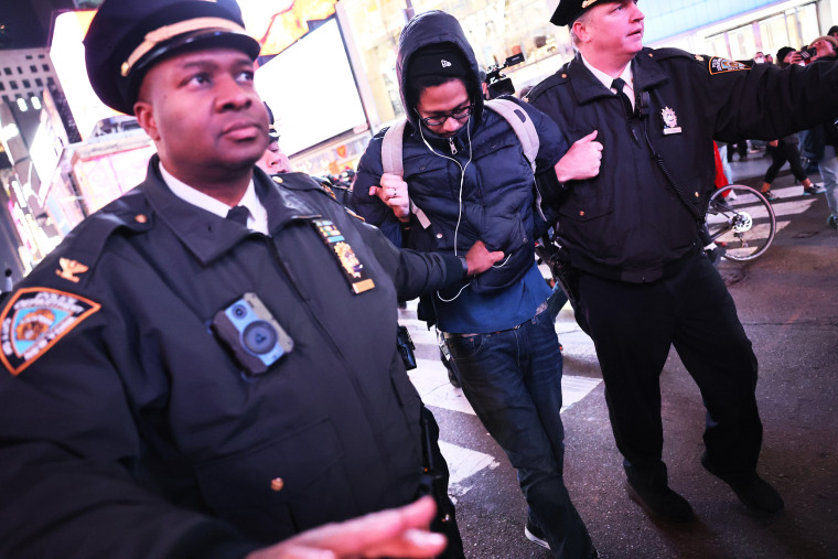 NEW YORK, NEW YORK - JANUARY 27: NYPD officers arrest a demonstrator as people protest the death of Tyre Nichols on January 27, 2023 in New York City. The release of a video depicting the fatal beating of Nichols, a 29-year-old Black man, sparked protests in NYC and other cities throughout the country. Nichols was violently beaten for three minutes and killed by Memphis police officers earlier this month after a traffic stop. Five Black Memphis Police officers have been fired after an internal investigation found them to be â€œdirectly responsibleâ€ for the beating and have been charged with â€œsecond-degree murder, aggravated assault, two charges of aggravated kidnapping, two charges of official misconduct and one charge of official oppression.â€ (Photo by Michael M. Santiago/Getty Images)