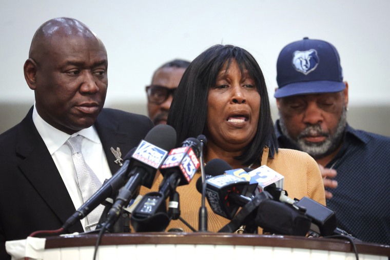 Flanked by civil rights attorney Ben Crump (L) and her husband Rodney Wells, RowVaughn Wells, mother of Tyre Nichols, speaks during a press conference on January 27, 2023 in Memphis, Tennessee. Tyre Nichols, a 29-year-old Black man, died three days after being severely beaten by five Memphis Police Department officers during a traffic stop on January 7, 2023. Memphis and cities across the country are bracing for potential unrest when the city releases video footage from the beating to the public later this evening.