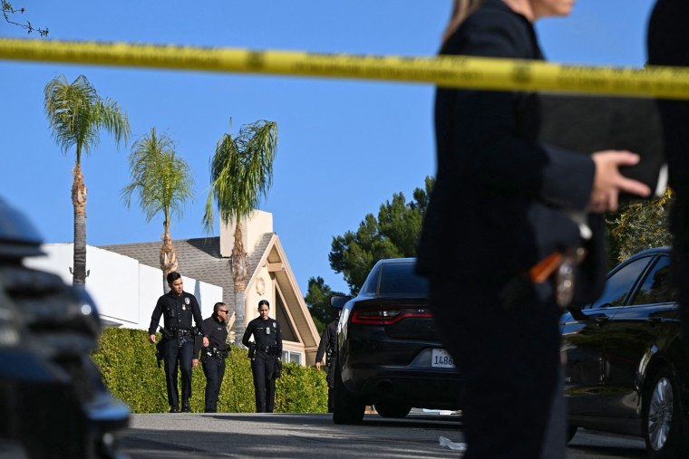 Law enforcement work an investigation of an early morning shooting in Beverly Crest, Los Angeles.