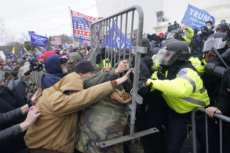 Protesters clash with police and security forces at the U.S. Capitol
