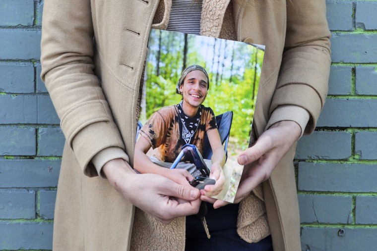 Vienna holds a photo of her slain partner, Tortuguita, in Atlanta on Jan. 26, 2023.