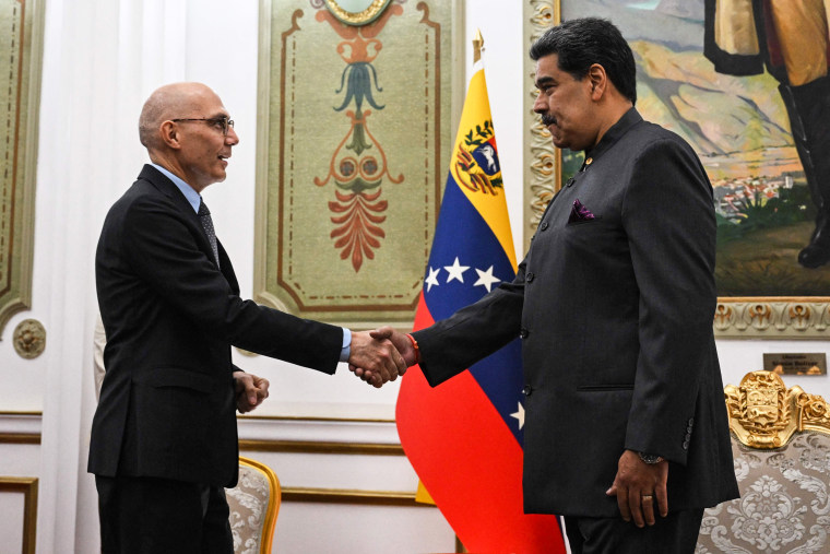 UN High Commissioner for Human Rights Volker Turk shakes hands with Venezuelan President Nicolas Maduro in Caracas, Venezuela, on Jan. 27, 2023.
