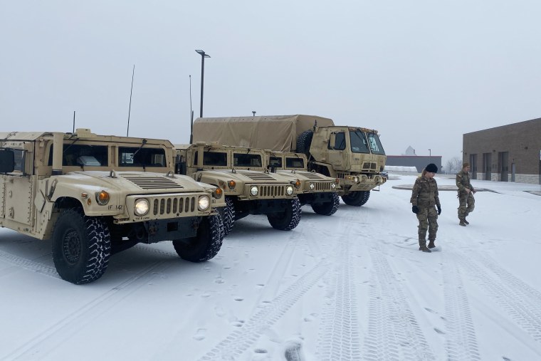 Soldiers from the 142nd Field Artillery in Lowell, Ark., brave inclement weather Jan. 30.