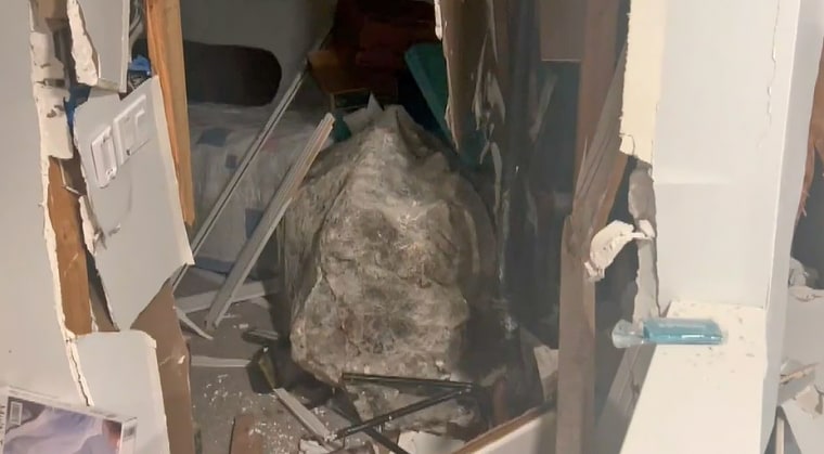 A boulder that crashed into a home in Honolulu, Hawaii. The Fire Department said the boulder is about 5 feet in height and width.