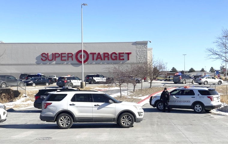 Police officers gather outside a Target store in Omaha, Neb.