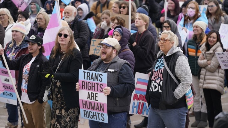 People gather in support of transgender youth during a rally at the Utah State Capitol