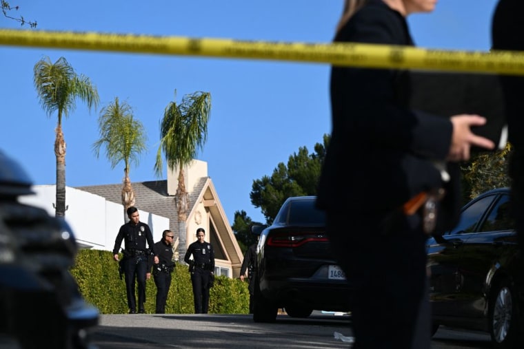 Officers respond to a multiple homicide in Beverly Crest, California on January 28, 2023.