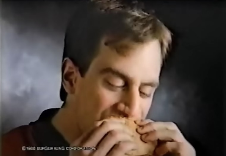 A young Christoper Meloni bites into his Yumbo sandwich in a commercial for Burger King.