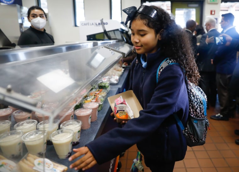 A girl chooses her lunch at John Liechty High School in Los Angeles, California, on December 7, 2022.