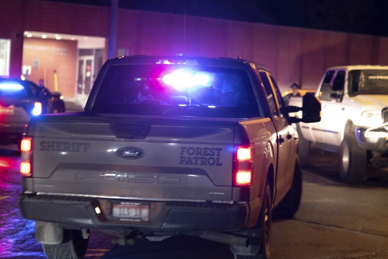 The truck with with paper blocking some of its windows and believed to be transporting Kohberger arrives in a police motorcade at the Latah County Courthouse on Jan. 4, 2023, in Moscow, Idaho.