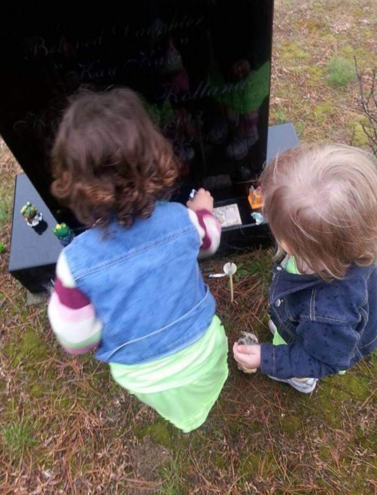 Two of Elizabeth Krasinski's children, visiting their aunt's grave on her birthday.