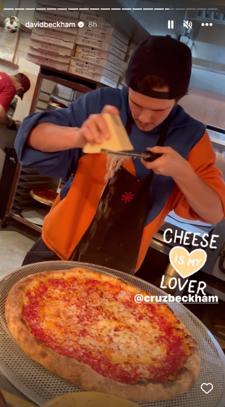 David shared video of his son putting cheese on a pizza.