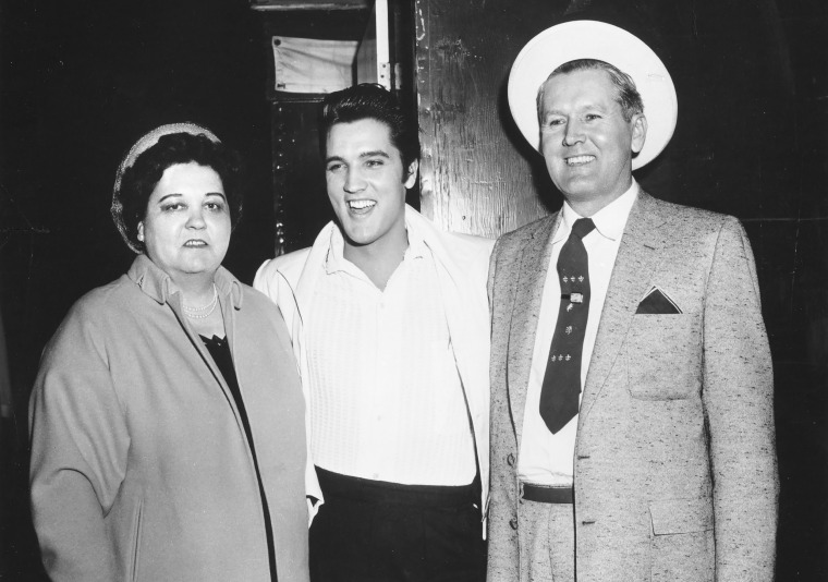 Elvis Presley with his parents Vernon and Gladys in 1961.