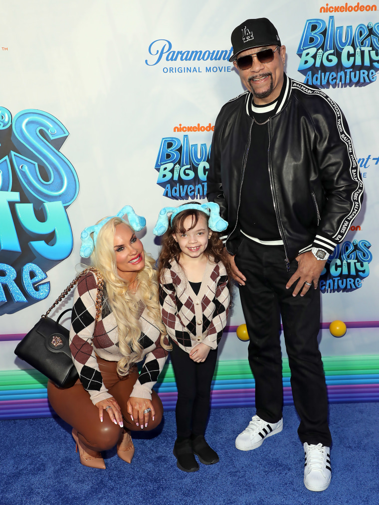 Ice-T stands beside his wife and daughter.