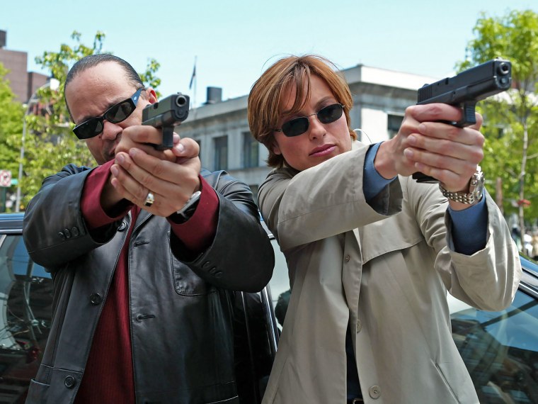 Actors Ice-T and Mariska Hargitay point their hand guns in front of them on an episode of Law and Order: Special Victims Unit.