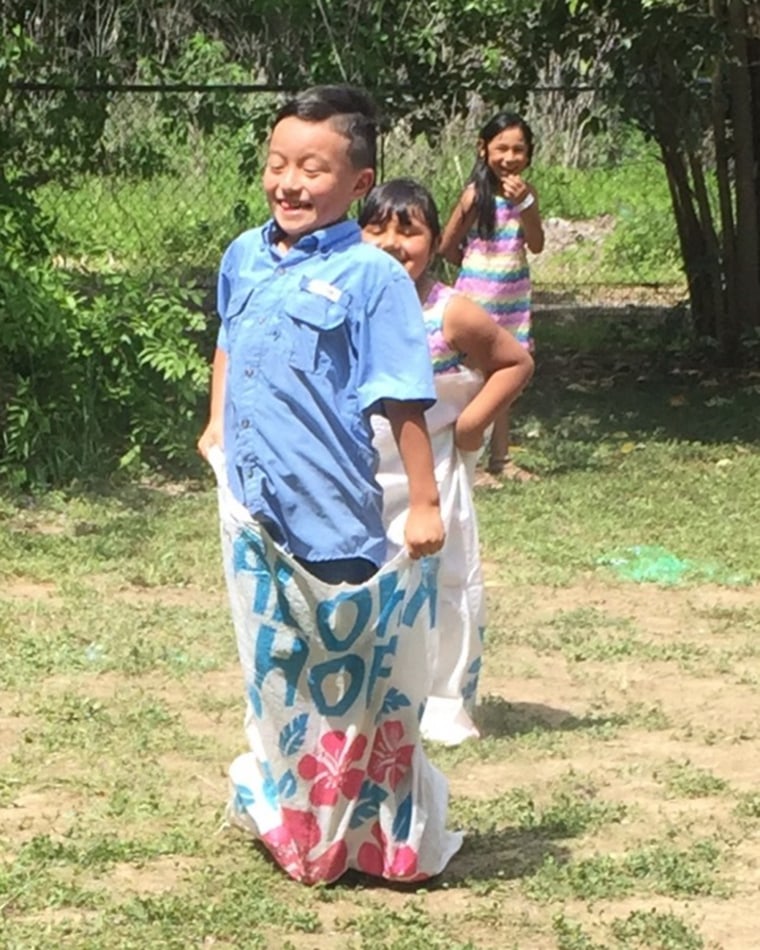 Daniel Ruiz playing hopsack with his cousin, Ellie Garcia.