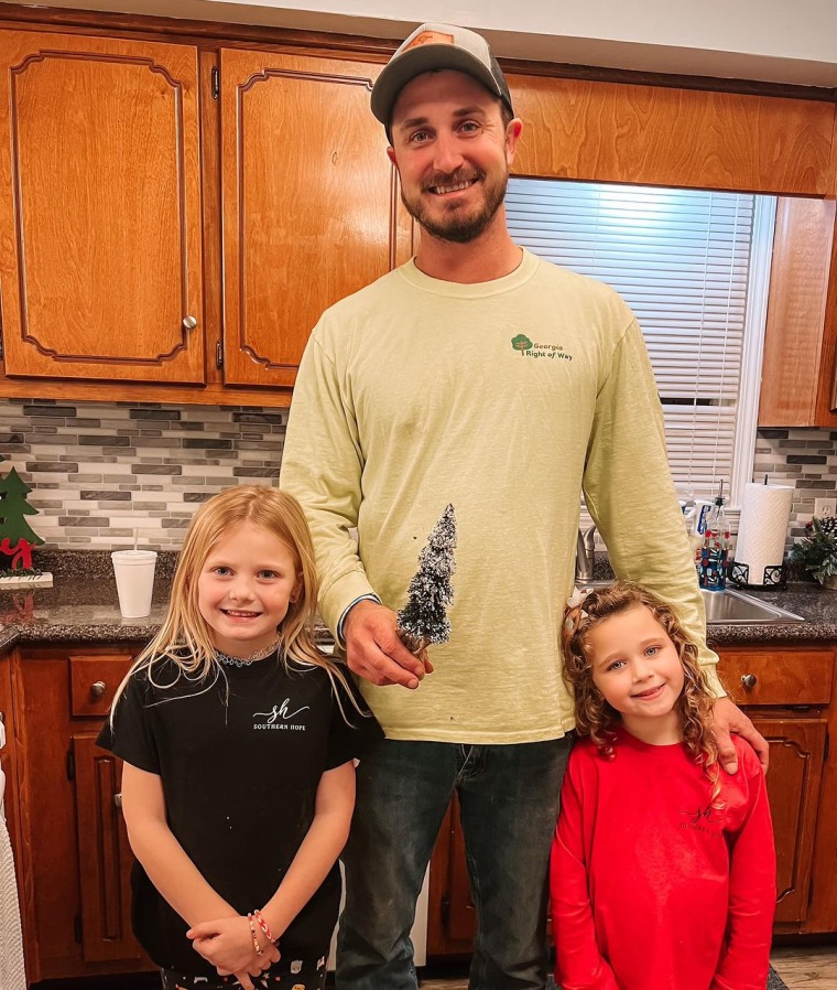 Jesse Maxwell with his daughters Maddie and River.