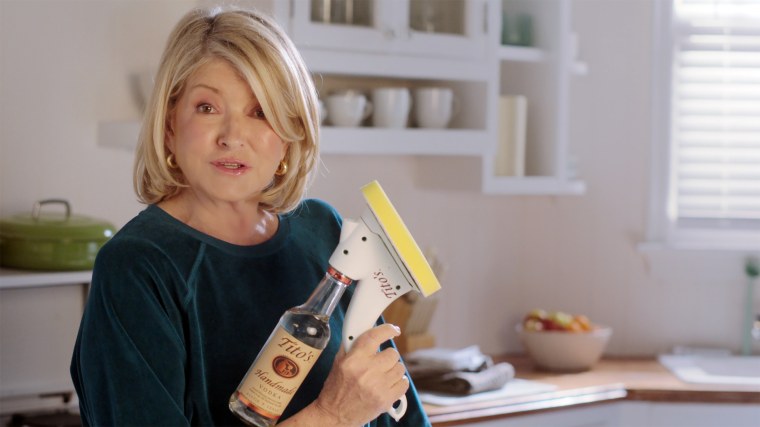 Martha cleans the kitchen with Tito's.