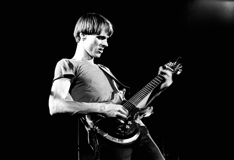 Tom Verlaine of Television performs on stage at Hammersmith Odeon, London, 28 May 1977. He is playing an Ampeg Dan Armstrong guitar.