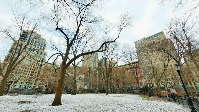 A thin layer of snow covers Madison Square Park in New York on Feb. 2, 2023.