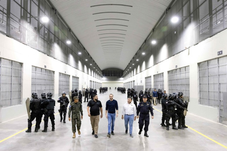 President Nayib Bukele, center, visits a newly inaugurated prison in an isolated rural area in a valley near Tecoluca, El Salvador