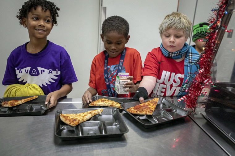 Second-grade students select their meals at Yavapai Elementary School in Scottsdale, Ariz., on Dec. 12, 2022. 