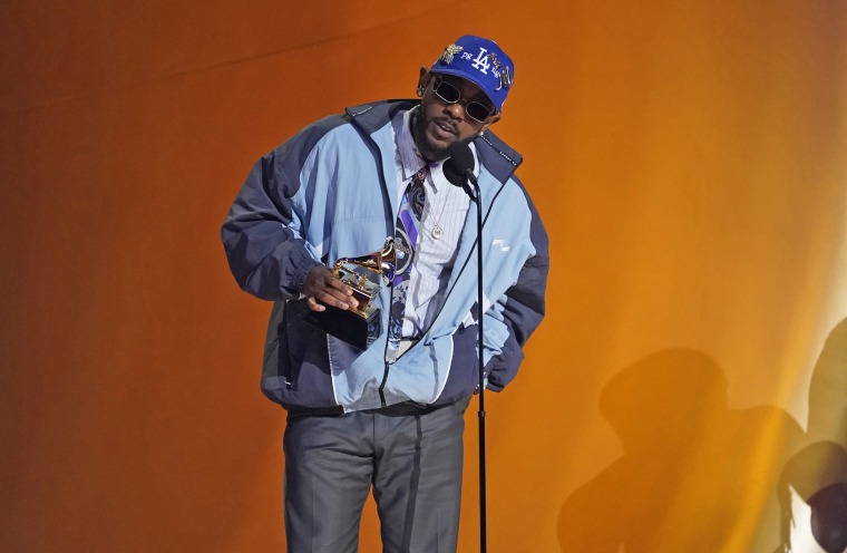Kendrick Lamar accepts the award for best rap album.