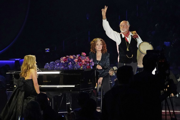 Sheryl Crow, left, Bonnie Raitt and Mick Fleetwood perform "Songbird" during a tribute to the late singer Christine McVie. 