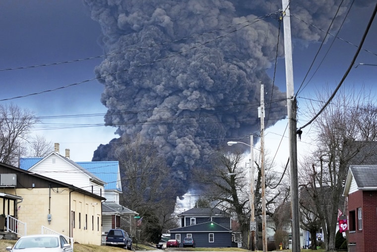 A black plume rises over East Palestine, Ohio, as a result of a controlled detonation of a portion of the derailed Norfolk and Southern trains Monday, Feb. 6, 2023.