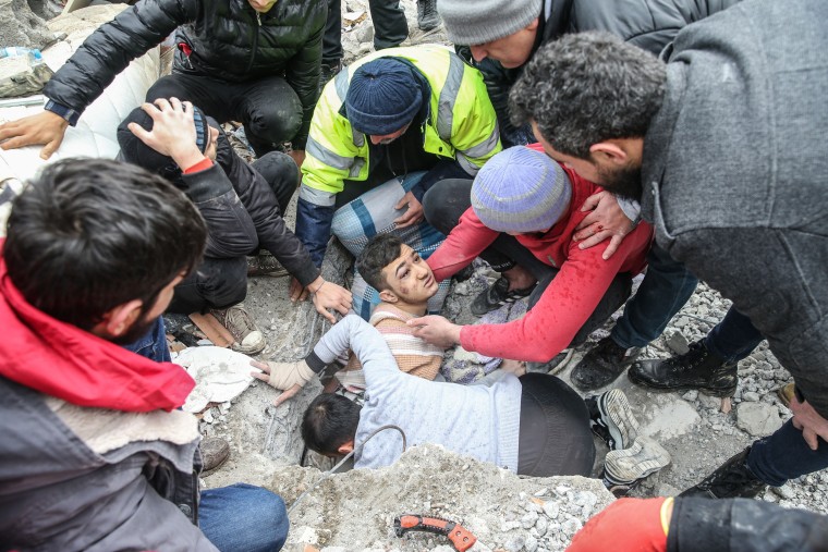 Mehmet Emin Ataoglu is rescued from under the rubble of 6 story building in Hatay, Turkey