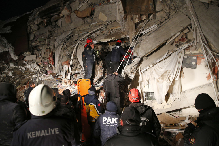 Several people are rescued from under the rubble of a collapsed building in Malatya, Turkey, on Feb. 6, 2023.
