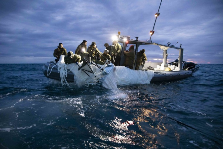 U.S. Navy sailors recover a high-altitude surveillance balloon off the coast of Myrtle Beach, S.C. on Sunday.