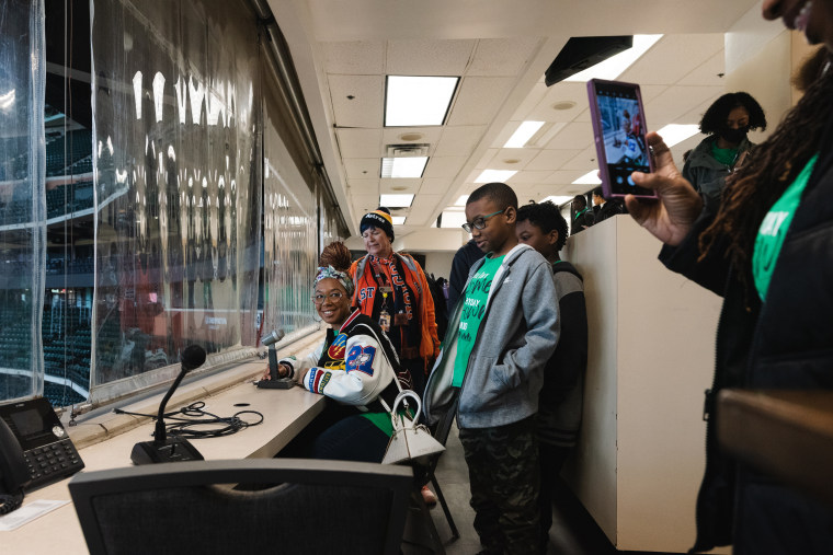 Sherrell Moorer poses behind the  announcers mic in the press box at Minute Maid Park in Houston, Texas on Jan. 27, 2023.