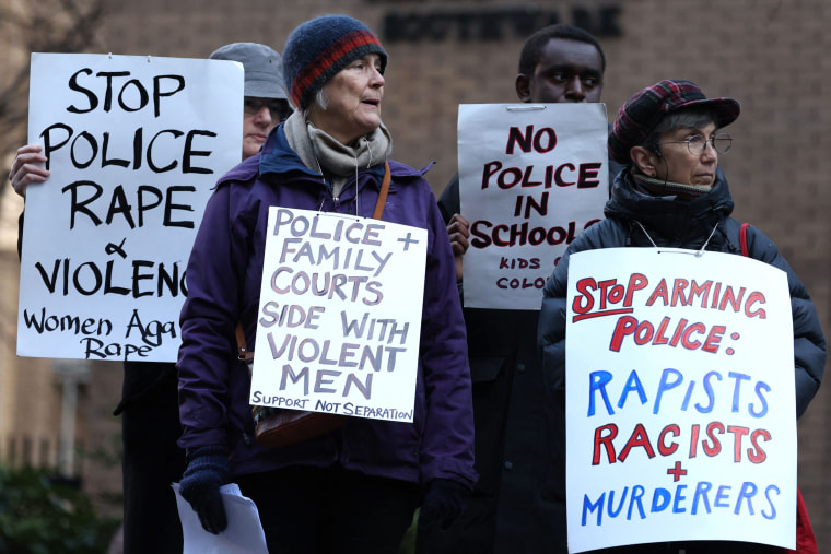 Protesters outside Southwark Crown Court in London on Feb. 6, 2023 during the two-day sentencing of serial rapist police officer David Carrick.