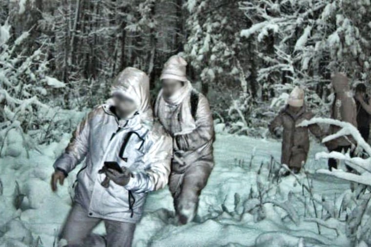 U.S. Border Patrol cameras capture migrants crossing the border into the U.S. near Mooers, N.Y., during a winter storm last December.