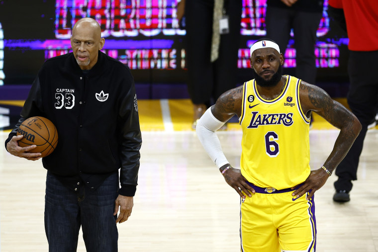 LOS ANGELES, CALIFORNIA - FEBRUARY 07: Kareem Abdul-Jabbar stands on court with LeBron James #6 of the Los Angeles Lakers after James passed Abdul-Jabbar to become the NBA's all-time leading scorer, surpassing Abdul-Jabbar's career total of 38,387 points against the Oklahoma City Thunder at Crypto.com Arena on February 07, 2023 in Los Angeles, California. NOTE TO USER: User expressly acknowledges and agrees that, by downloading and or using this photograph, User is consenting to the terms and conditions of the Getty Images License Agreement. (Photo by Ronald Martinez/Getty Images)