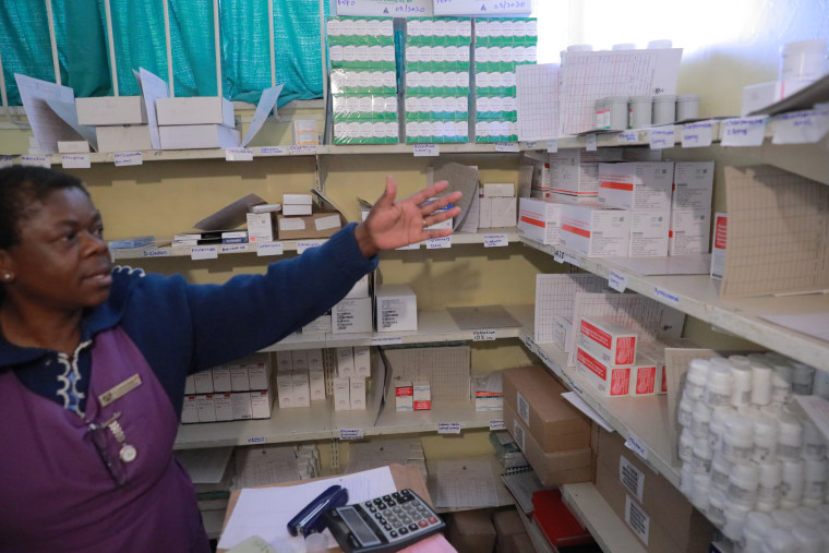 A health care worker in the store closet of the Rutsanana Primary Care Clinic, which provides
care and treatment for people with HIV in Harare, Zimbabwe.