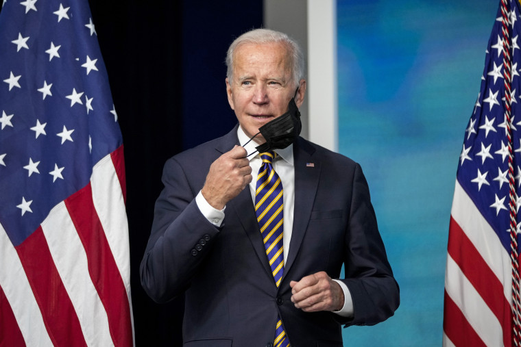 President Joe Biden removes his mask before speaking about the coronavirus pandemic in Washington on Oct. 14, 2021.
